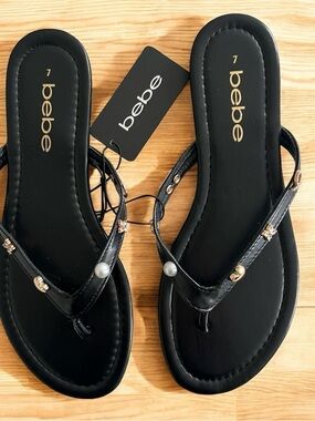 bebe Black Pearl & Gold Accent T-Strap Sandals